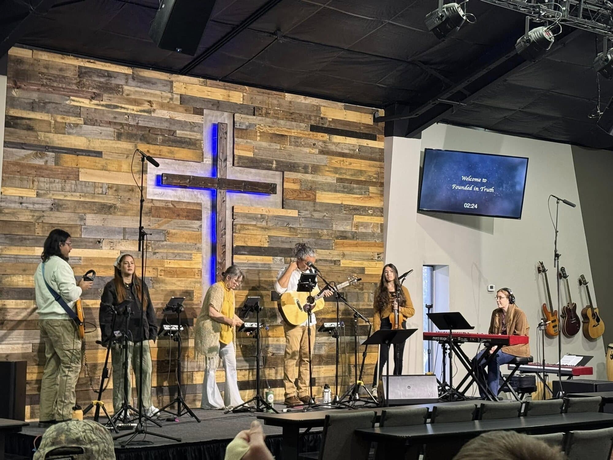Worship before the cross at Founded in Truth